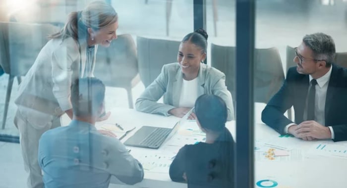 Five business professionals planning their annual marketing budget