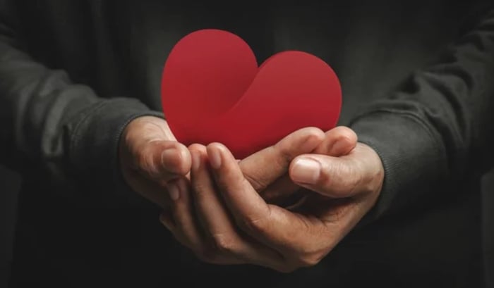 Hands holding heart
